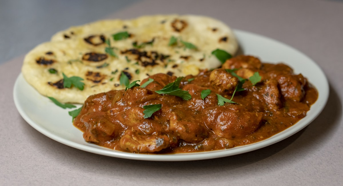 Butter chicken curry served with fresh naan