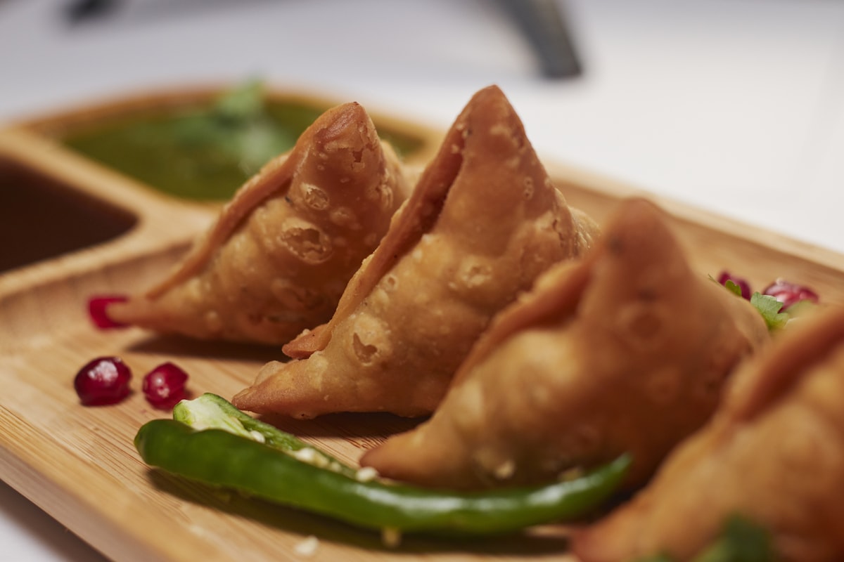 Crispy vegetable samosas with green chutney